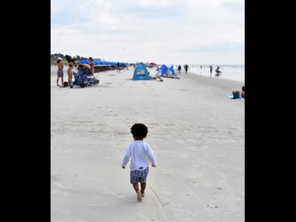 Toddler walking on Hilton Head Beach, South Carolina