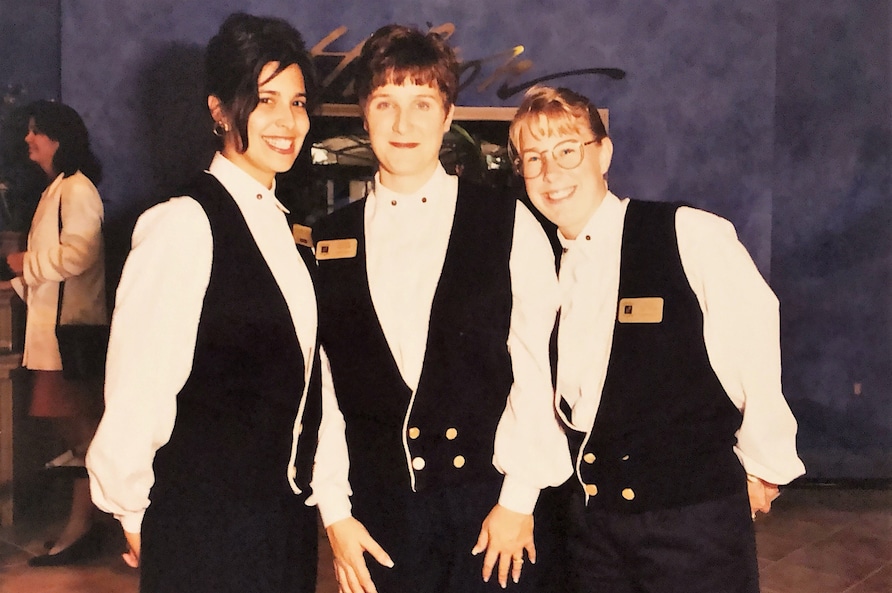 Three Team Members posing and smiling at HIlton Grand Vacations at SeaWorld on opening day in Orlando, Florida.
