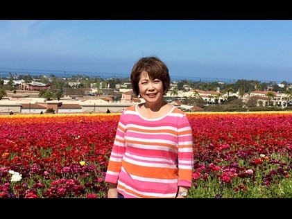 Hilton Grand Vacations Owner posing with the wildflower blooms during the Southern California wildflower superbloom.
