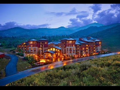 Sunrise Lodge, a Hilton Grand Vacations Club in Park City, Utah a glow on a summer night. 